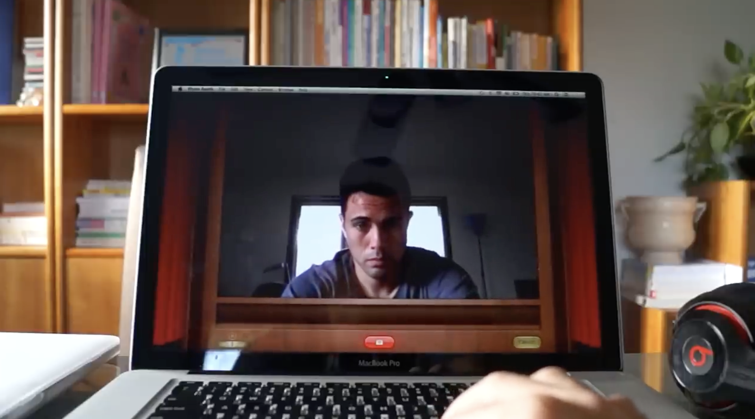 Jonathan Brax on a MacBook screen while testing its built-in camera for an early Great Buy Electronics video