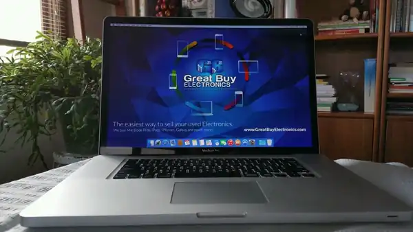 Laptop open against a Great Buy Electronics product backdrop